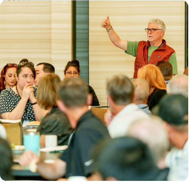 A man giving a presentation to an audience.